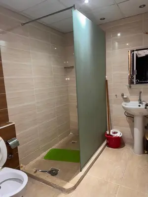 a bathroom with a shower and a toilet and a sink at Modern 1bedroom in Hurghada in Hurghada