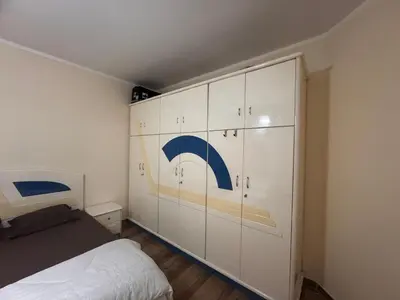 a bedroom with a bed and a wall of cabinets at Modern 1bedroom in Hurghada in Hurghada