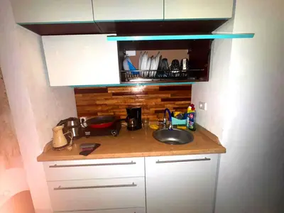 a kitchen counter with a sink and a microwave at Cozy Studio in Hurghada in Hurghada