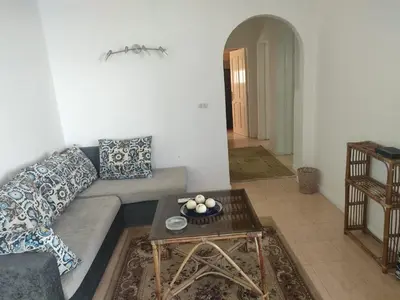 a living room with a couch and a table at Apartment Sama Beach in Hurghada
