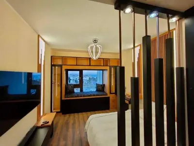 a bedroom with a bed and a large window at Al-Daw Compound, Al-Mohammadi Square in Hurghada
