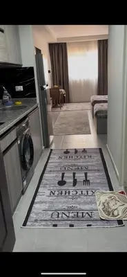 a living room with a rug on the floor of a kitchen at غرفة فندقية in Hurghada
