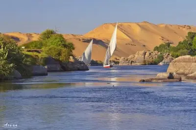 two sailboats on a river in the desert at Taha nubian boat in Jazīrat Aswān