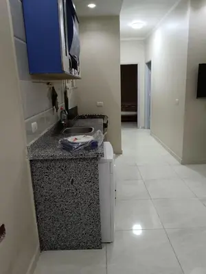 a kitchen with a sink and a counter top at شقق وشاليهات ايجار in Hurghada