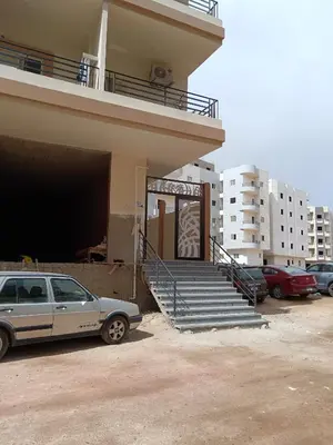 a car parked in front of a building with stairs at شقق وشاليهات ايجار in Hurghada