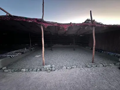 a building with a tent with rocks under it at Scenery Khalaf malky in Hurghada