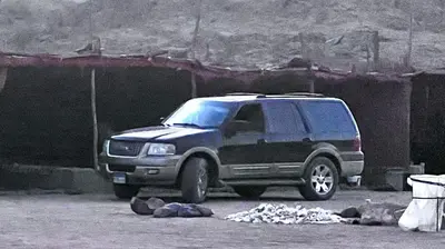 a black suv parked in a parking lot at Scenery Khalaf malky in Hurghada