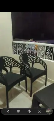 two black chairs sitting in front of a wall at الغردقه الوفاء in Hurghada