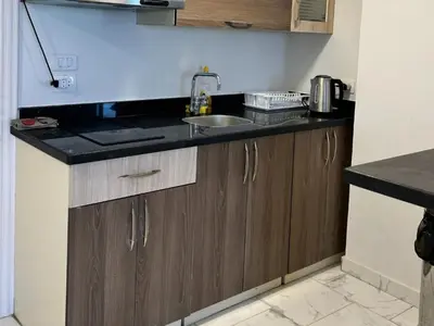 a kitchen with a sink and a counter top at Cozy 1-Bedroom Chalet with Sea View in Hurghada