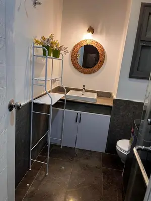 a bathroom with a sink and a mirror at استوديو أنيق في الجونة in Hurghada