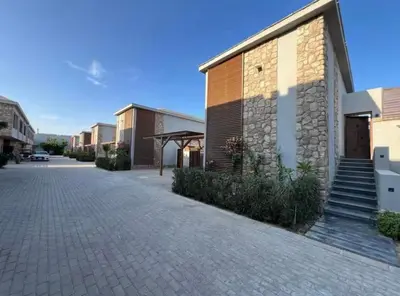 a cobblestone street in front of a building at شاليه بالي بمسبح خاص مدفأ in Hurghada