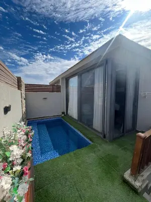 a small swimming pool in the backyard of a house at شاليه بالي بمسبح خاص مدفأ in Hurghada