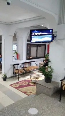a living room with a large flat screen tv on the wall at Oscar Hotel Aswan \u4e2d\u570b\u4eba\u4e4b\u5bb6 in Aswan