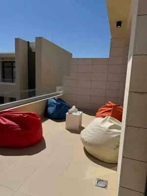 three bean bags sitting on the floor of a building at G Crips View in Hurghada