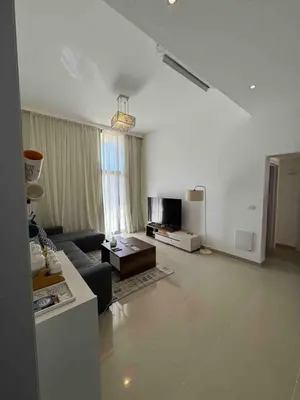 a living room with a couch and a table at G Crips View in Hurghada