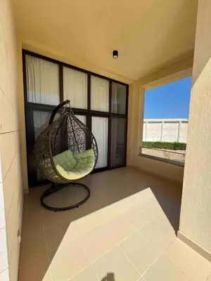 a room with a hammock on a balcony with a window at G Crips View in Hurghada