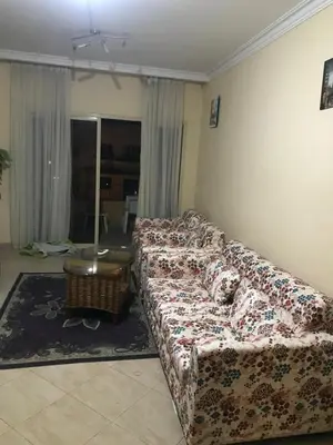 a living room with a couch and a table at Premier group in Hurghada