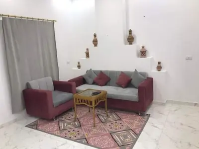 a living room with a couch and a table at Premier group in Hurghada