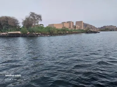 a large body of water with buildings in the distance at ISIS Hostel in Aswan