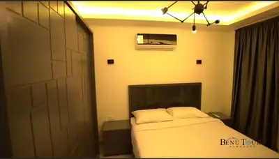 a bedroom with a bed and a large door at Selena bay 006 in Hurghada