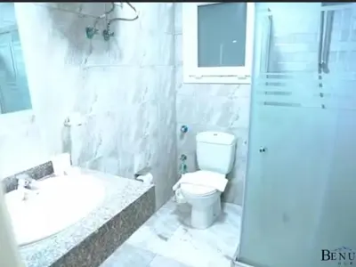 a bathroom with a toilet and a sink and a shower at Selena bay 006 in Hurghada