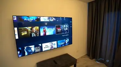 a flat screen tv hanging on a wall at Selena bay 006 in Hurghada