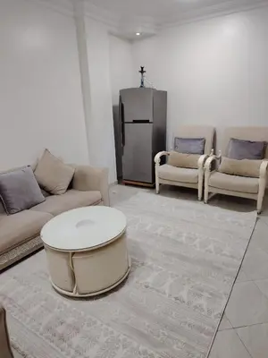 a living room with a couch and a coffee table at Family apartment in front of the sea in Hurghada