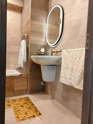 a bathroom with a sink and a mirror at Chalet in Hurghada