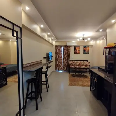 a living room with a bar and a couch at Princess Resort, Hurghada in Hurghada
