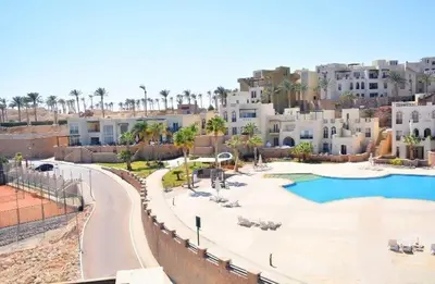 a resort with a swimming pool and some buildings at Azzura Sahl Hasheesh in Hurghada