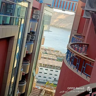 a view of the ocean from the balcony of a building at شقة فاخرة اسوان in Aswān