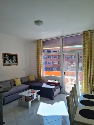 a living room with a couch and a large window at Oasis Resort Soraya - 2 bed apt, recently renovated and fully furnished with pool views in Al Ahyaa Hurghada Egypt in Hurghada