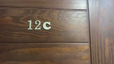 a wooden door with the number on it at El princess one bedroom hurghada in Hurghada