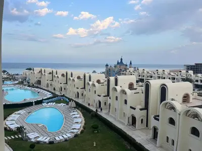 an aerial view of a large building with a pool at Gravity Apartments Sea View Pool View للأجانب فقط Just For Foreigners in Hurghada