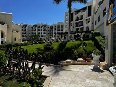 a view of a courtyard of a building with plants at Gravity Apartments Sea View Pool View للأجانب فقط Just For Foreigners in Hurghada