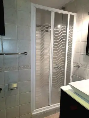 a shower with a glass door in a bathroom at استديو ايجار في الغردقه 206 in Hurghada