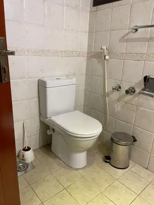 a bathroom with a white toilet in a room at استديو ايجار في الغردقه 206 in Hurghada