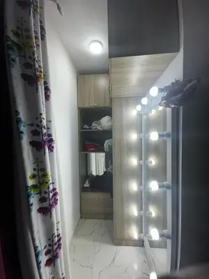 a room with a closet with a shower and a curtain at 2 bedroom apartment in Prestige Plaza in Hurghada