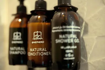 a group of three bottles ofnatural conditioner on a wall at Shepherd I Dahabya in Esna