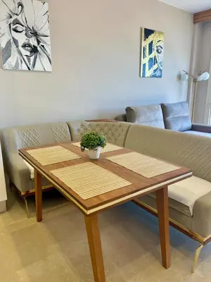 a living room with a table and a couch at SunShine M9 Mangroovy in Hurghada