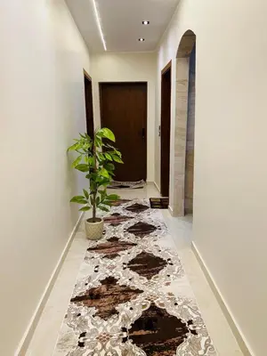 a hallway with a potted plant on the floor at Fontana Guste house in Luxor