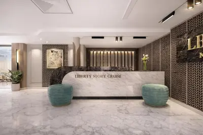 a lobby with a therapy show counter and two blue stools at Five-Stars Deluxe River Kruz from Aswan to Luxor 3 Nights in Aswān