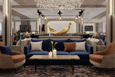 a living room with a blue couch and a chandelier at Five-Stars Deluxe River Kruz from Aswan to Luxor 3 Nights in Aswān