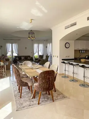 a dining room and kitchen with a table and chairs at Unique Hill Villa 3 BD In Gouna in Hurghada