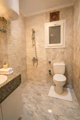 a bathroom with a toilet and a sink at Selena Bay Prime Stays in Hurghada