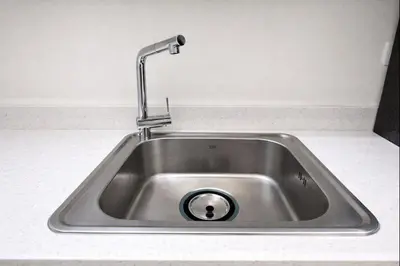 a stainless steel sink with a faucet in a kitchen at Selena Bay Prime Stays in Hurghada