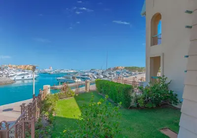 a balcony with a view of a marina at Upscale 2BR Mosaique Marina Stay, Yachts & Sea Views in Hurghada