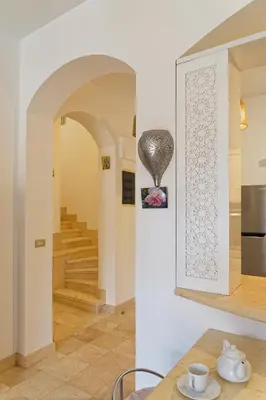 a room with a staircase and a vase on the wall at VESTA - El Gouna Residence in Hurghada