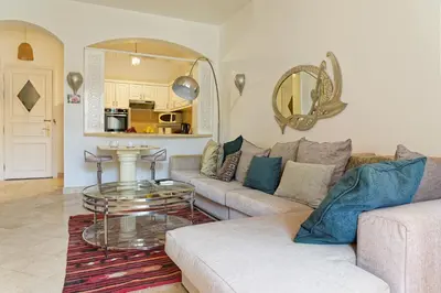 a living room with a couch and a table at VESTA - El Gouna Residence in Hurghada