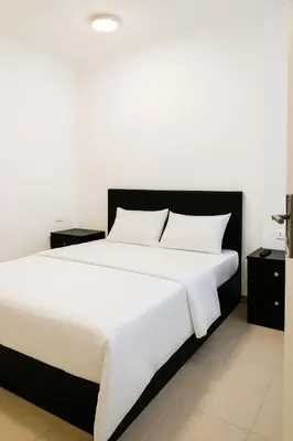 a bedroom with a large bed with white sheets and pillows at One Bedroom Chalet with Side Sea View ,Turtles, Hurghada Concierge D 14 6 in Hurghada